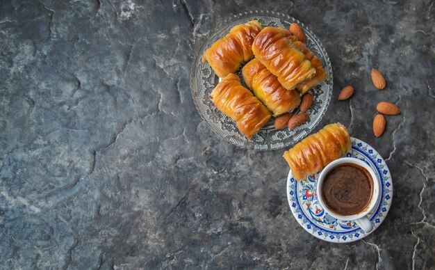 A cup of Turkish coffee and baklava. 