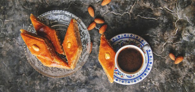 A cup of Turkish coffee and baklava. 