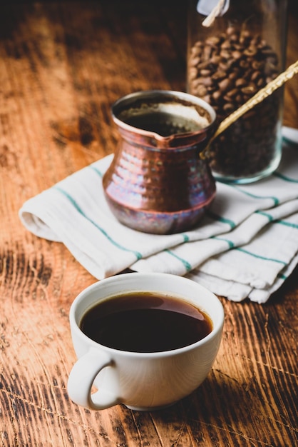 Cup of turkish coffee on wooden table