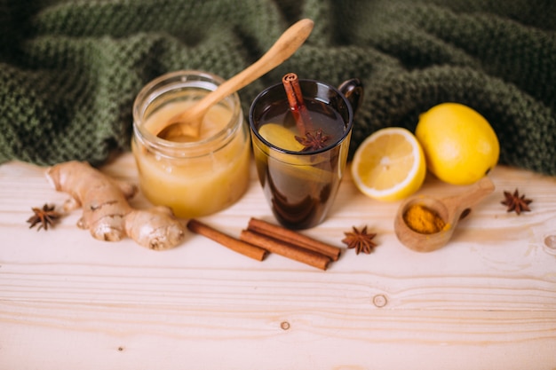 Photo cup warm water with lemon, honey, ginger, cinnamon and anise.