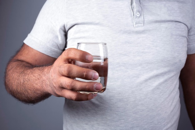 cup water in man handclose up