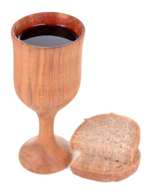 Cup of wine and bread isolated on white