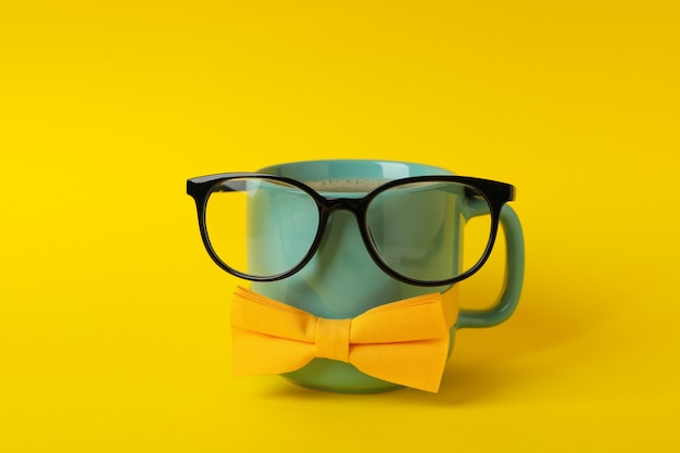 Photo cup with bow tie and glasses