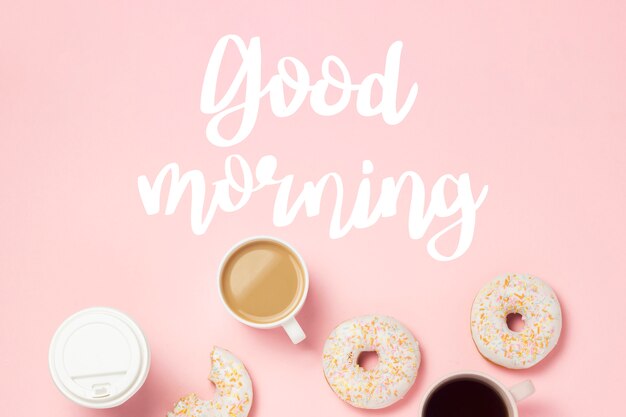 Photo cup with coffee or tea, fresh tasty sweet donuts on a pink background. good morning. bakery concept