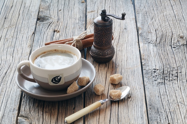 Cup with coffee on wood table