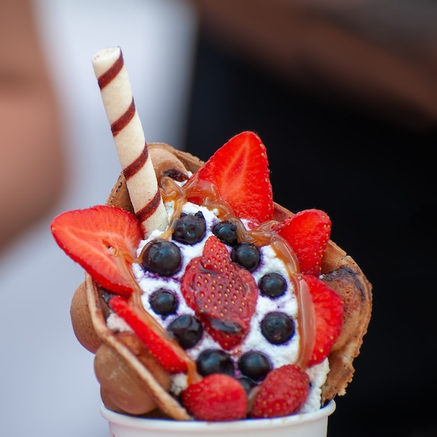 Cup with delicious sweet bubble waffle