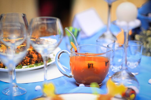 Cup with a fruit compote on the table