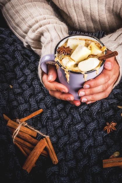 Cup with hot spicy pumpkin white chocolate, with marshmallow and cinnamon, anise