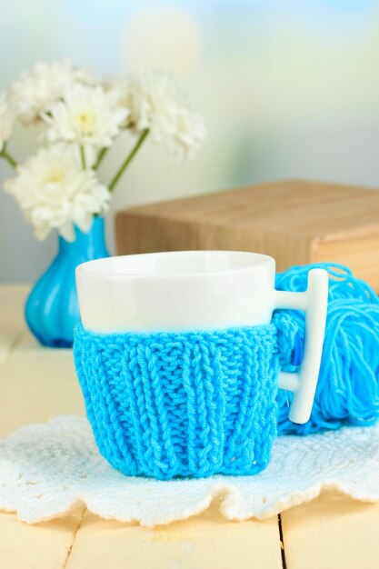 Cup with knitted thing on it close up