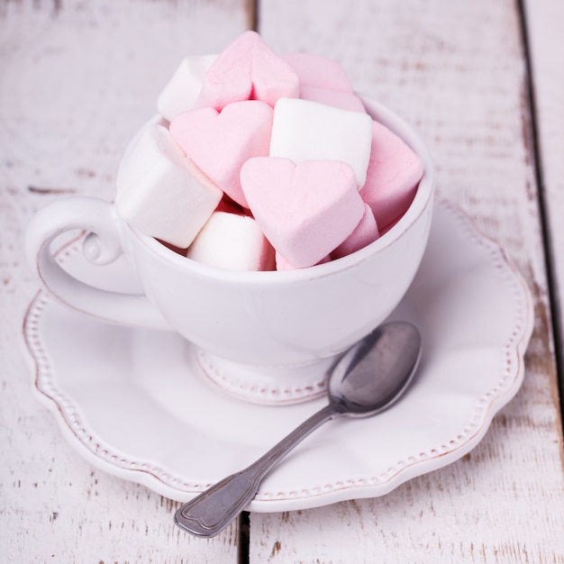 Photo cup with marshmallows in heart shape