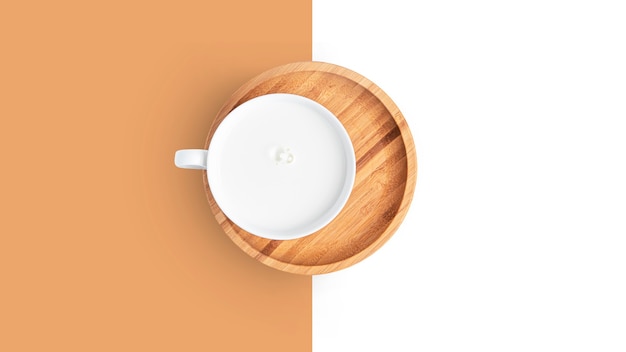 Cup with milk drink on a plate on a white background