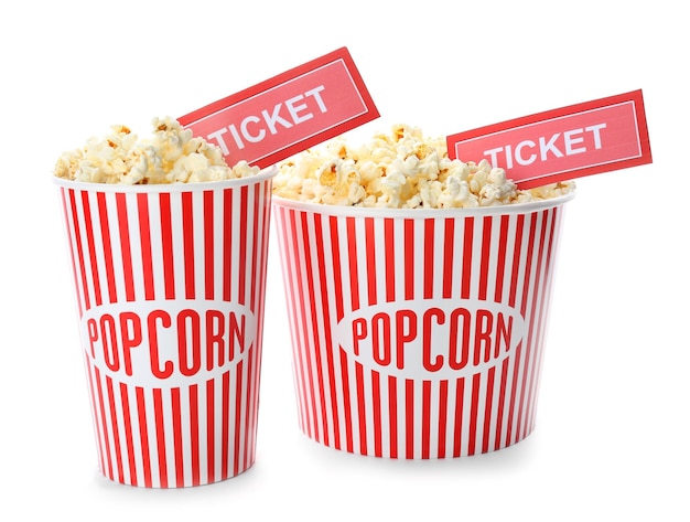 cup with popcorn and cinema tickets on white background