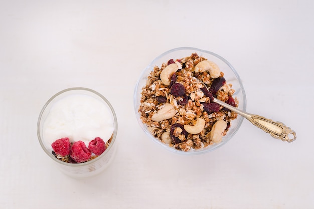 Cup of yogurt and granola bowl. 