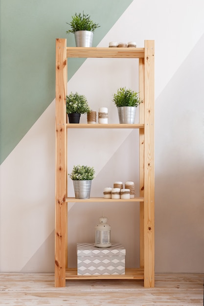 Photo cupboard decorated with candles, green plants