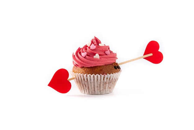 Cupcake decorated with sugar hearts and a cupid arrow for Valentine's Day isolated on white background