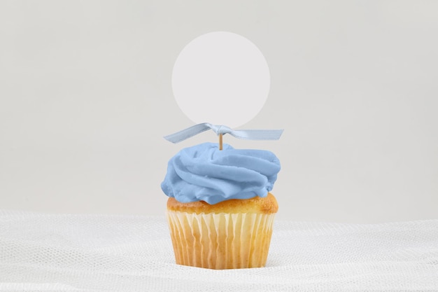 Photo cupcake topper mockup with blue tied ribbon