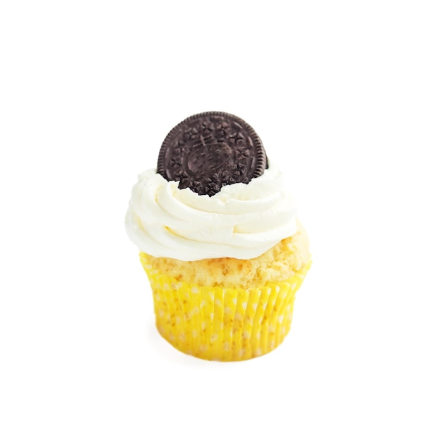 Cupcake with cream and biscuits on a white background The concept of food desserts holiday