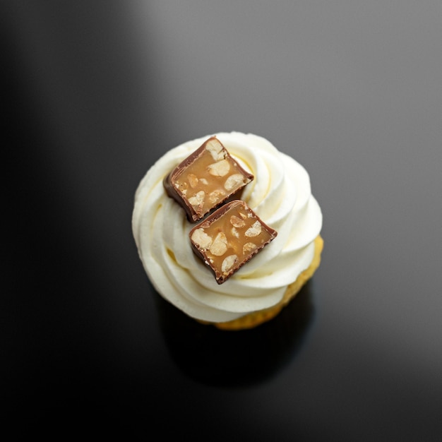 Cupcake with delicate cream and chocolate Top view The concept of food desserts holiday