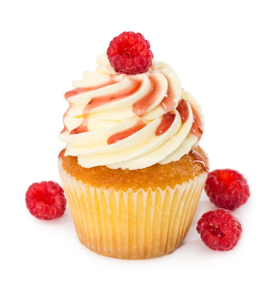 Cupcake with fresh raspberries and raspberry syrup isolated on white background