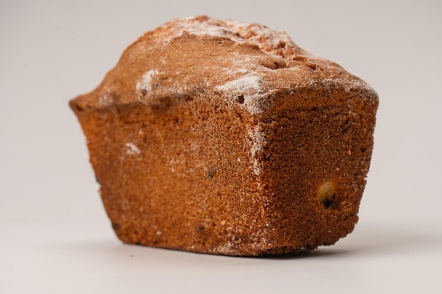 A cupcake with raisins isoalted on a white background