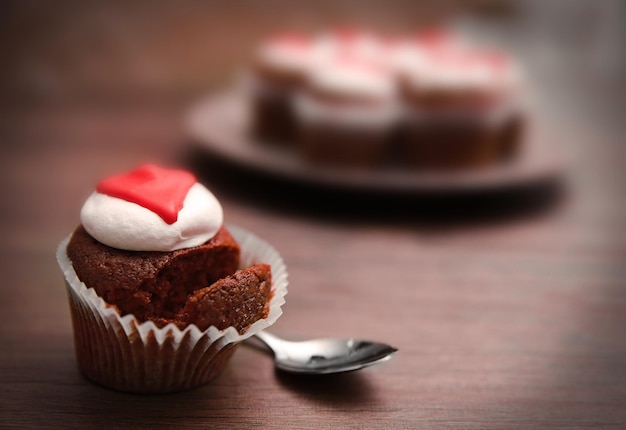 Cupcake on wooden background closeup