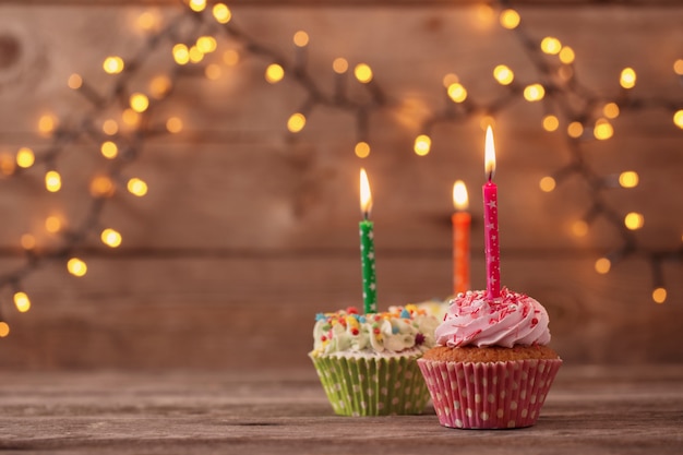 Cupcakes on dark old wooden table