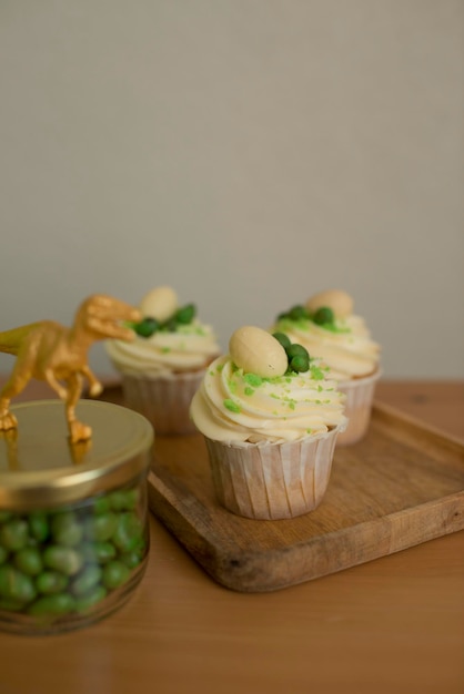 Cupcakes decorated with candy in the form of dinosaur eggs