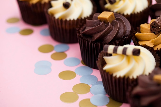 Cupcakes decorated with chocolatecaramel and vanilla icing