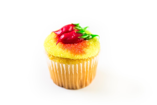 Cupcakes decorated with red chili peppers for Cinco de Mayo.