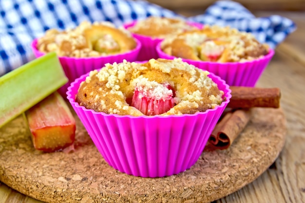 Cupcakes in tins with rhubarb, rhubarb, cinnamon, napkin