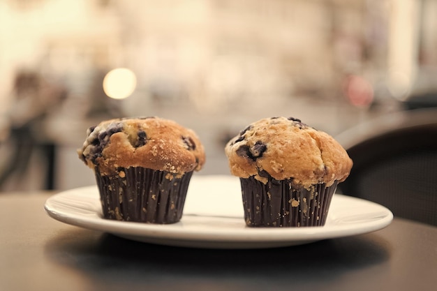 Cupcakes with blueberry on white plate in paris france