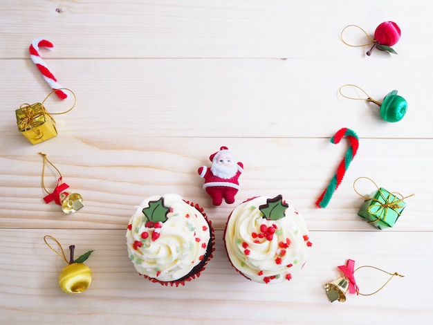 Cupcakes with christmas shape and ornament decoration on wooden table