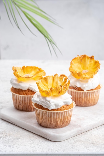 Cupcakes with dried pineapple flowers