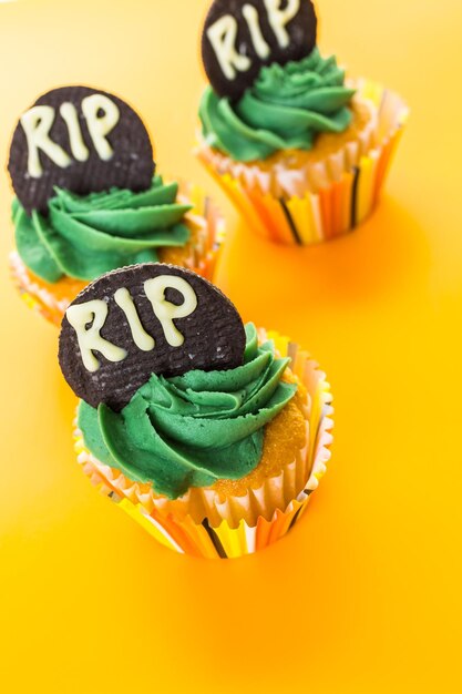 Cupcakes with green icing prepared as halloween treats