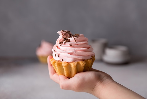 Cupcakes with pink meringues on top. Wedding, valentine's day sweet food concept. Russian cake tartlet. Desserts and sweets.