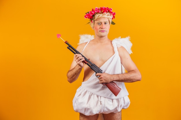 Cupid holding a shotgun. armed cupid