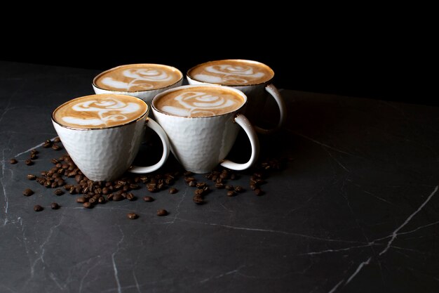 Cups of coffee on a marble table