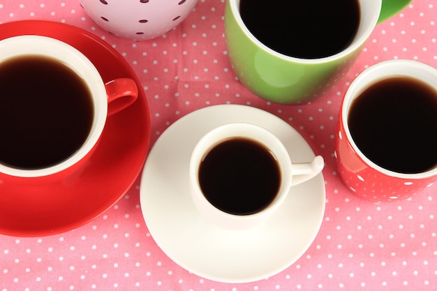 Cups of coffee on pink napkin