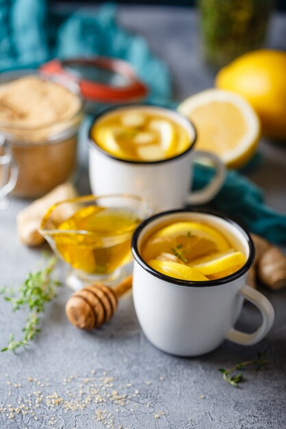 Cups of ginger tea with honey and lemon