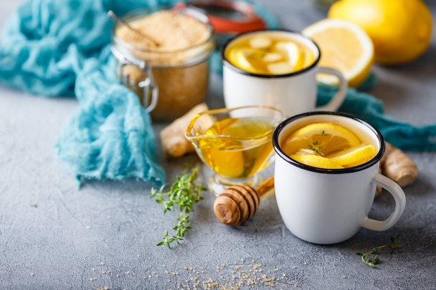 Cups of ginger tea with honey and lemon