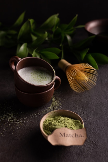 Photo cups of green matcha tea with milk