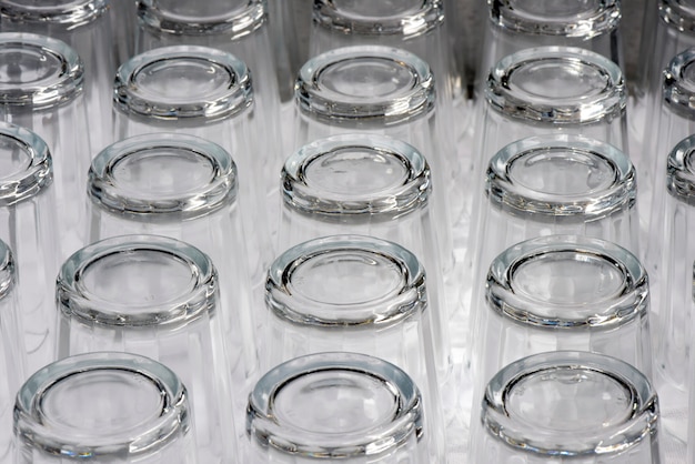 Photo cups lined up in cupboard of popular restaurant