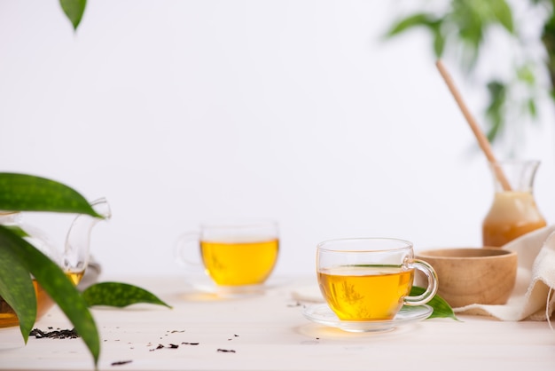 Cups of tea on wooden table background