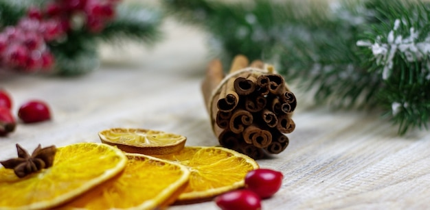 Cups with hot mulled wine on a wooden background. New year concept