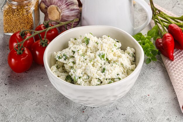 Curd cheese with green herbs spread