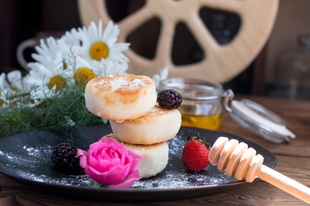 curd cheesecakes on a black plate Grocery still life cooking recipe