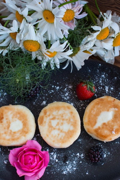 curd cheesecakes on a black plate Grocery still life cooking recipe