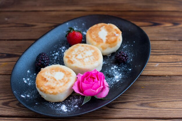 curd cheesecakes on a black plate Grocery still life cooking recipe