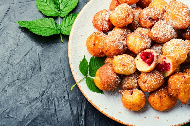 Curd donuts with raspberries