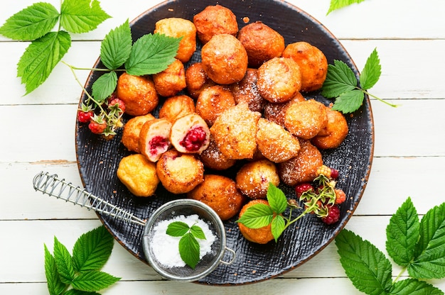 Curd donuts with raspberries